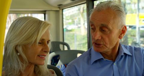 Happy Senior Couple Enjoying City Bus Ride