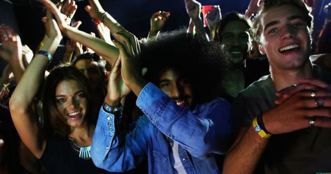 Energetic Audience Enjoying Concert Excitement - Download Free Stock Images Pikwizard.com