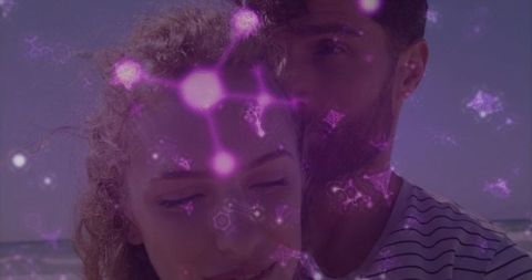 Couple Embracing on Beach with Digital Overlay