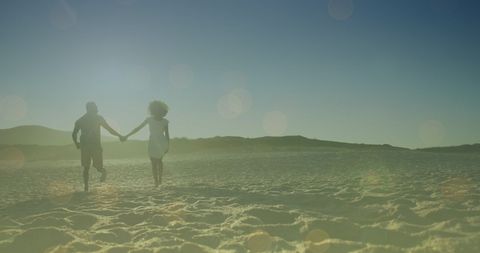 Romantic Couple Walking on Sunny Beach at Sunset - Download Free Stock Images Pikwizard.com