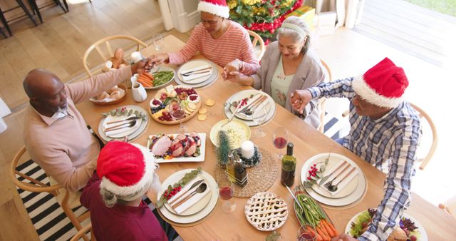 African American Family Celebrating Christmas Dinner Around Festive Table - Download Free Stock Images Pikwizard.com