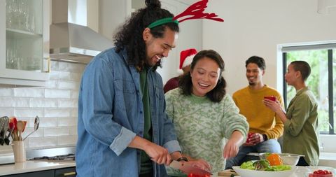Diverse Friends Enjoying Cooking Together During Holiday Gathering