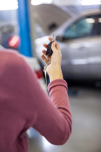 Customer holding keys at the storage garage