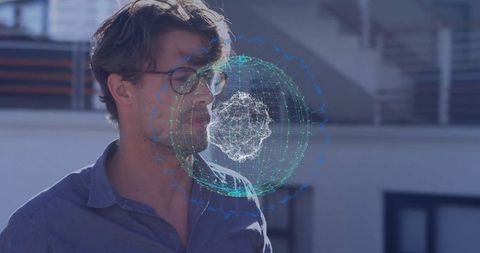 Professional using holographic interface on rooftop