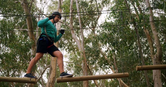 Man Balancing on Tree-top Obstacle Course in Forest Setting - Download Free Stock Images Pikwizard.com