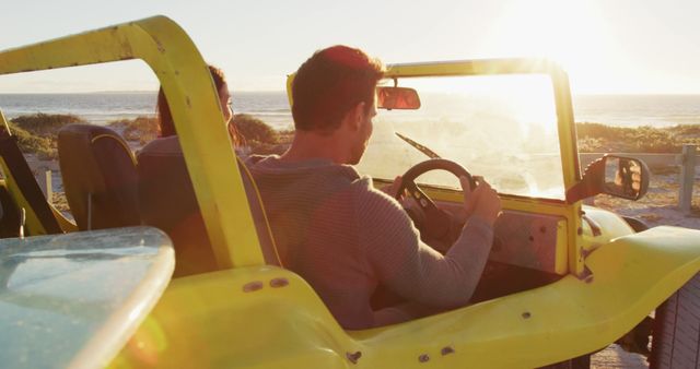 Couple Driving Beach Buggy During Sunset - Download Free Stock Images Pikwizard.com