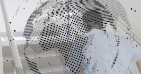 Ascending businessman climbing stairs with dotted globe overlay symbolizing global progress