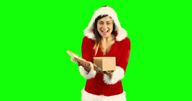 Woman in Santa Costume Opening Gift Box on Green Screen - Download Free Stock Images Pikwizard.com