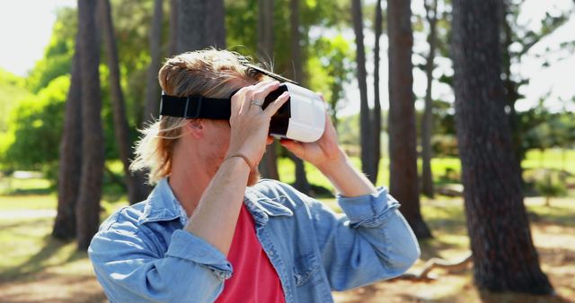 Man using virtual reality headset a summers day 