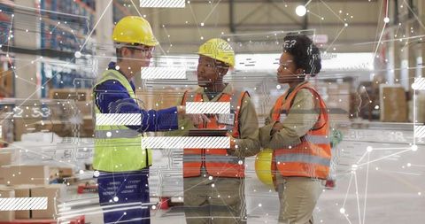 Warehouse team discussing logistics using ar overlay, workers in safety vests and helmets