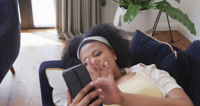 Relaxing Woman Using Smartphone at Home on Sofa - Download Free Stock Images Pikwizard.com