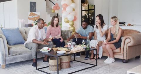 Diverse Friends Gathering at Home for Fun and Celebration