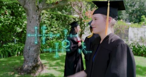 Female Graduate Wearing Mortarboard Walking Campus Lawn with Holographic Chemistry Formulas