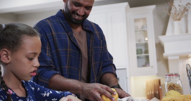 Father and daughter cooking together in kitchen - Download Free Stock Images Pikwizard.com