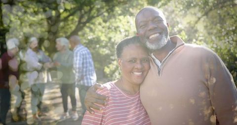 Happy Seniors Enjoying Outdoor Garden Gathering