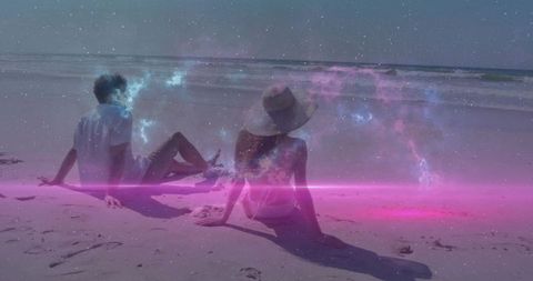 Couple relaxing on stargazing beach with ethereal cosmic nebula