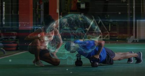 Athlete performing kettlebell pushup with coach and holographic brain overlay