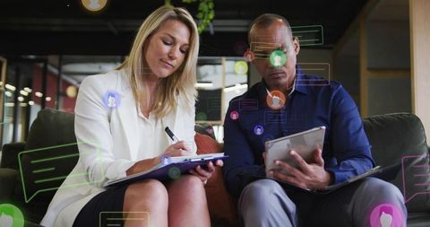 Business professionals collaborating with tablet and clipboard, digital messaging overlays