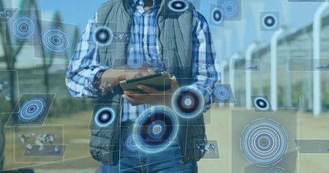 Digital Interface and Data Processing While Man Uses Tablet