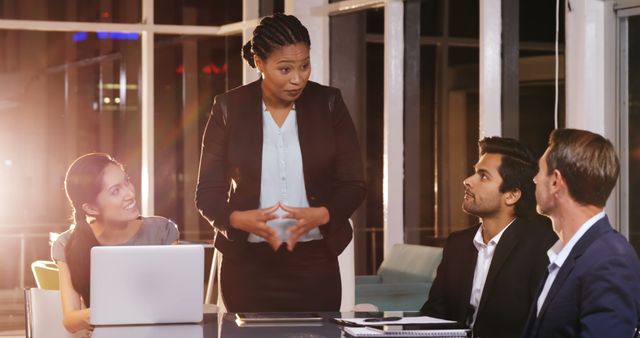 Businesswoman leading team meeting at office table - Download Free Stock Images Pikwizard.com