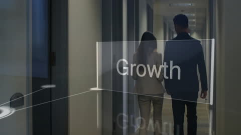 Business Colleagues Walking in Modern Office Corridor