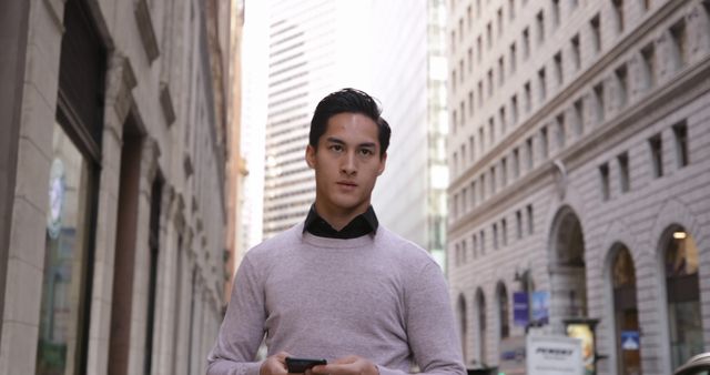 Confident young businessman walking in urban cityscape - Download Free Stock Images Pikwizard.com