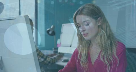 Caucasian Businesswoman Analyzing Statistical Data at Office Computer