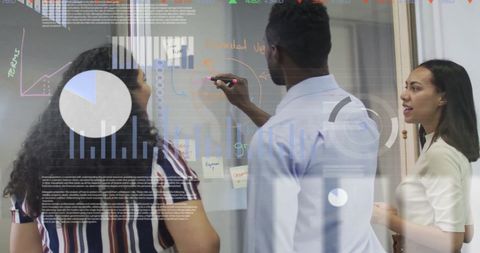 Diverse team collaborating on business strategy with data visualization