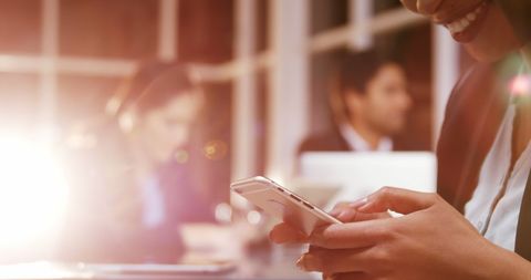 Business Professional Using Smartphone in Bright Office - Download Free Stock Images Pikwizard.com