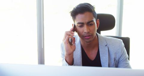 Business Professional Communicating on Smartphone in Corporate Office