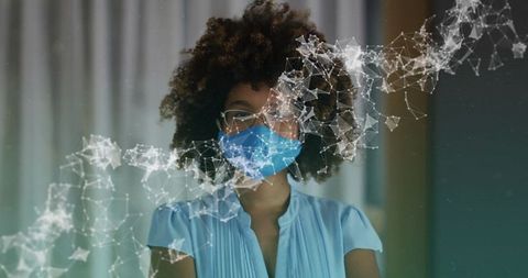 Woman wearing medical mask with digital network overlay for telehealth and safety