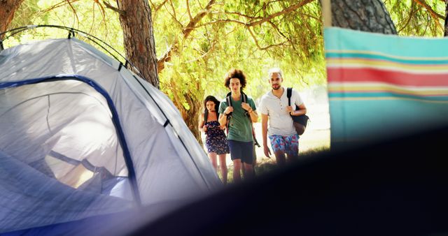 Group of Friends Arriving at Campsite Among Trees - Download Free Stock Images Pikwizard.com