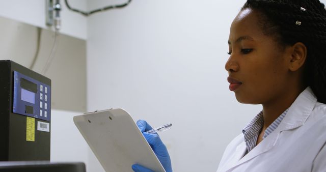 Young African American Female Scientist Recording Data in Laboratory - Download Free Stock Images Pikwizard.com