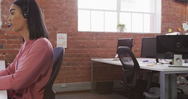 Young Businesswoman Using Headset in Modern Office - Download Free Stock Photos Pikwizard.com