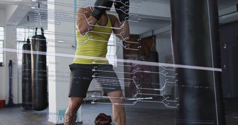 Boxer training with augmented reality hud overlay during heavy bag workout in boxing gym