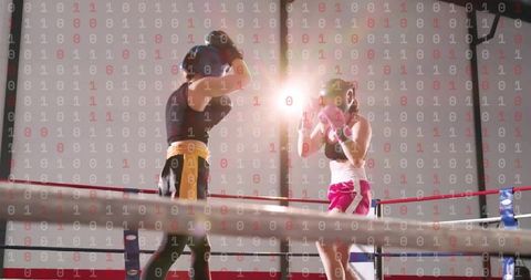 Female boxers sparring in ring wearing headgear and gloves, intense gym training