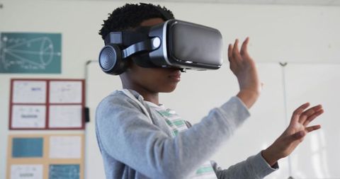 Student Exploring Virtual Reality Headset in Classroom for Interactive Learning and STEM