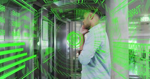 IT Technician Analyzing Holographic Data Stream in Futuristic Data Center Corridor
