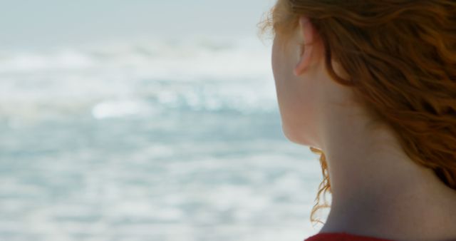 Woman with Red Hair Looking at Ocean from Back View - Download Free Stock Images Pikwizard.com