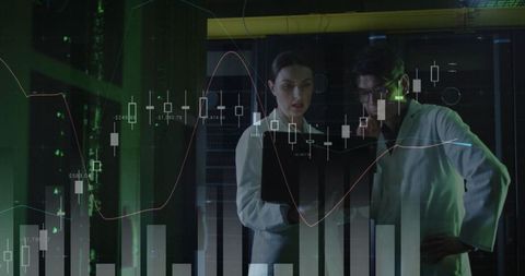 It engineers analyzing data by computer servers with digital graph overlay