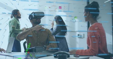 Team collaborating using vr headset at meeting table interacting with holographic interface