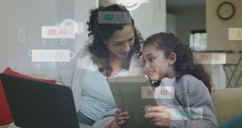 Mother and daughter learning on tablet with floating notifications in cozy living room