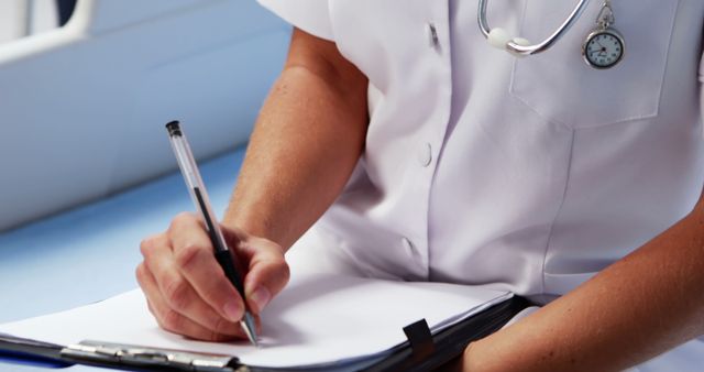 Nurse Writing Medical Notes on Clipboard in Hospital - Download Free Stock Images Pikwizard.com