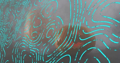 Turquoise topographic swirls on fogged glass revealing orange abstract form with teal mist