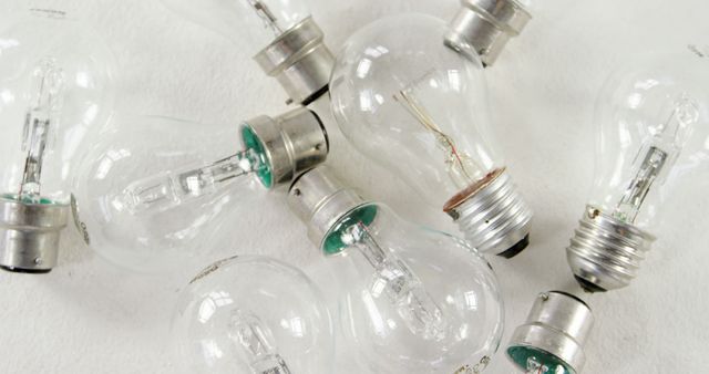 Scattered Incandescent Light Bulbs on White Surface - Download Free Stock Images Pikwizard.com