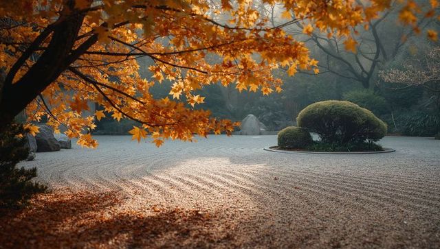 Tranquil japanese garden with autumn maple and raked gravel