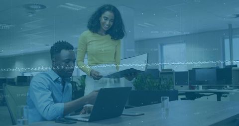 Professional Team Collaborating in Modern Open-Plan Office