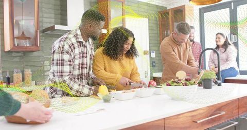 Group Preparing Fresh Salad at Sunlit Modern Kitchen Island During Casual Home Gathering