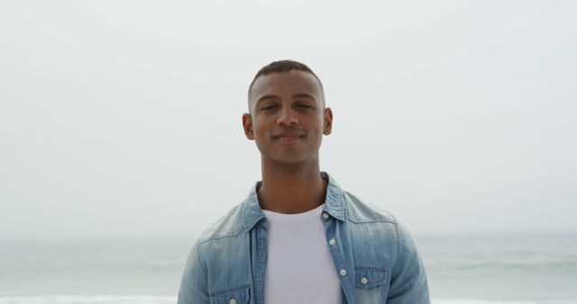 Confident Young Man Smiling Outdoors by the Sea - Download Free Stock Images Pikwizard.com