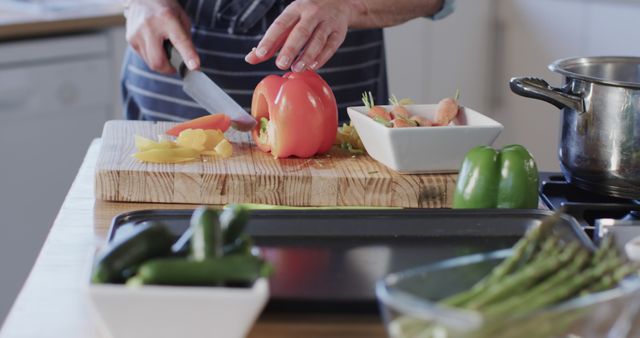 Home Cooking, Man Chopping Fresh Vegetables in Kitchen - Download Free Stock Images Pikwizard.com